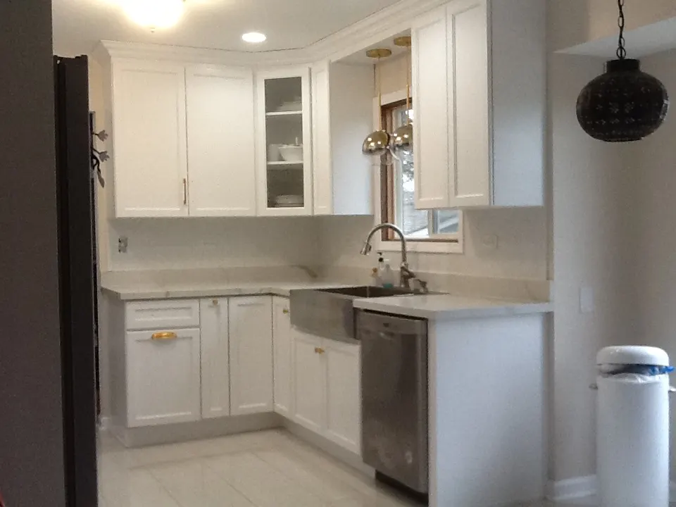 Kitchen with an apron farmhouse sink and custom base cabinets