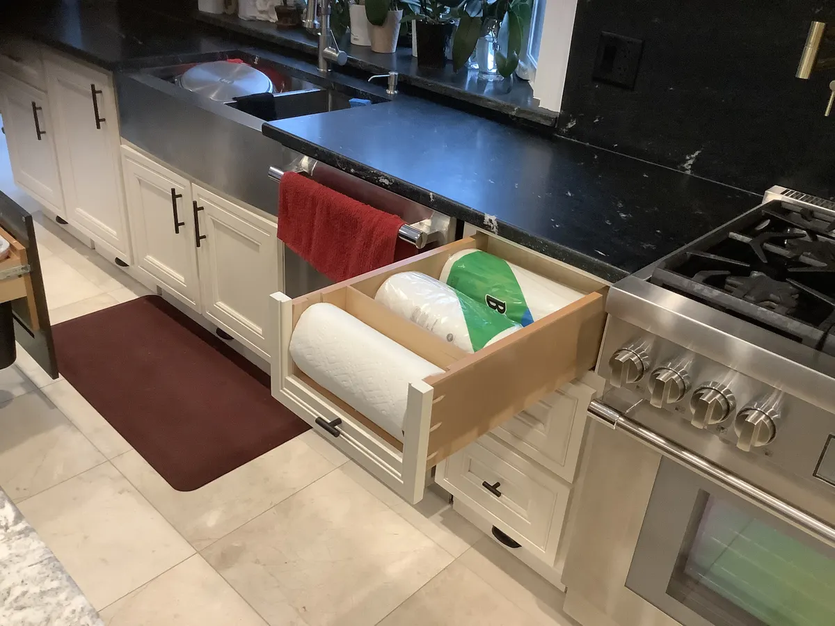 Pull-out paper towel roll storage