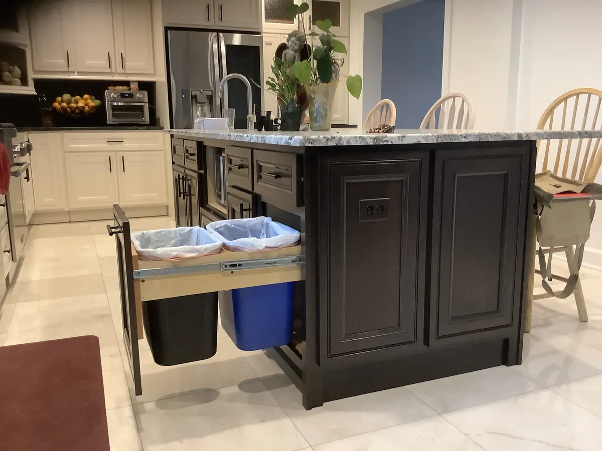 Hidden pull-out trash cabinet