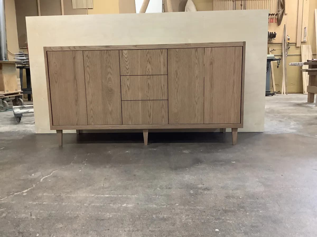 Custom walnut dresser with drawers open